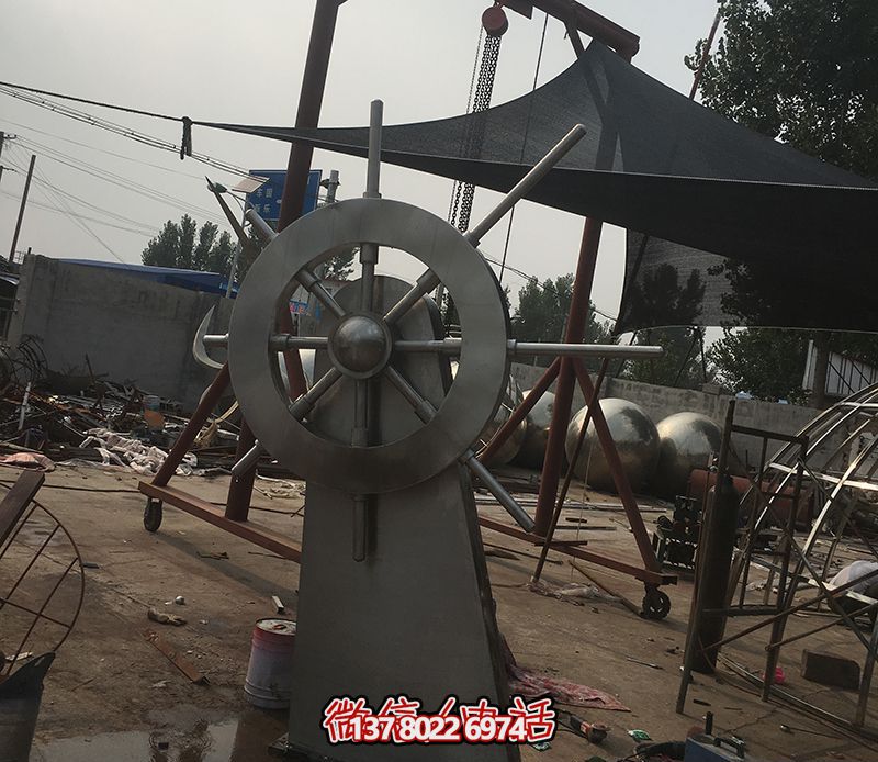 騰飛不銹鋼雕塑船舵，點綴室內(nèi)飯店